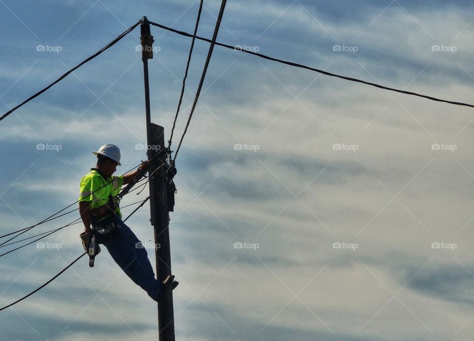 Electrician On A Wire