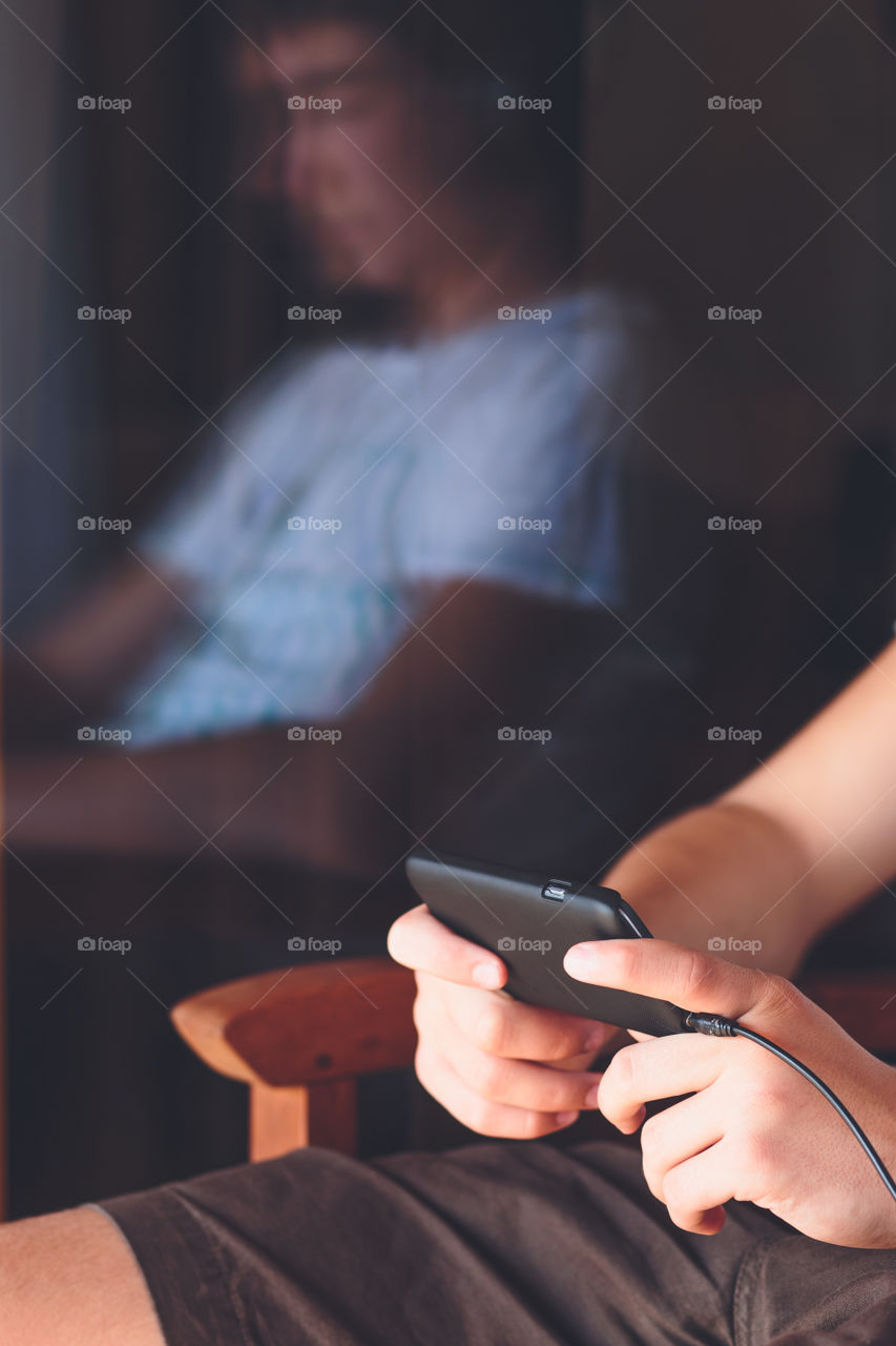 Close-up of boy using cellphone