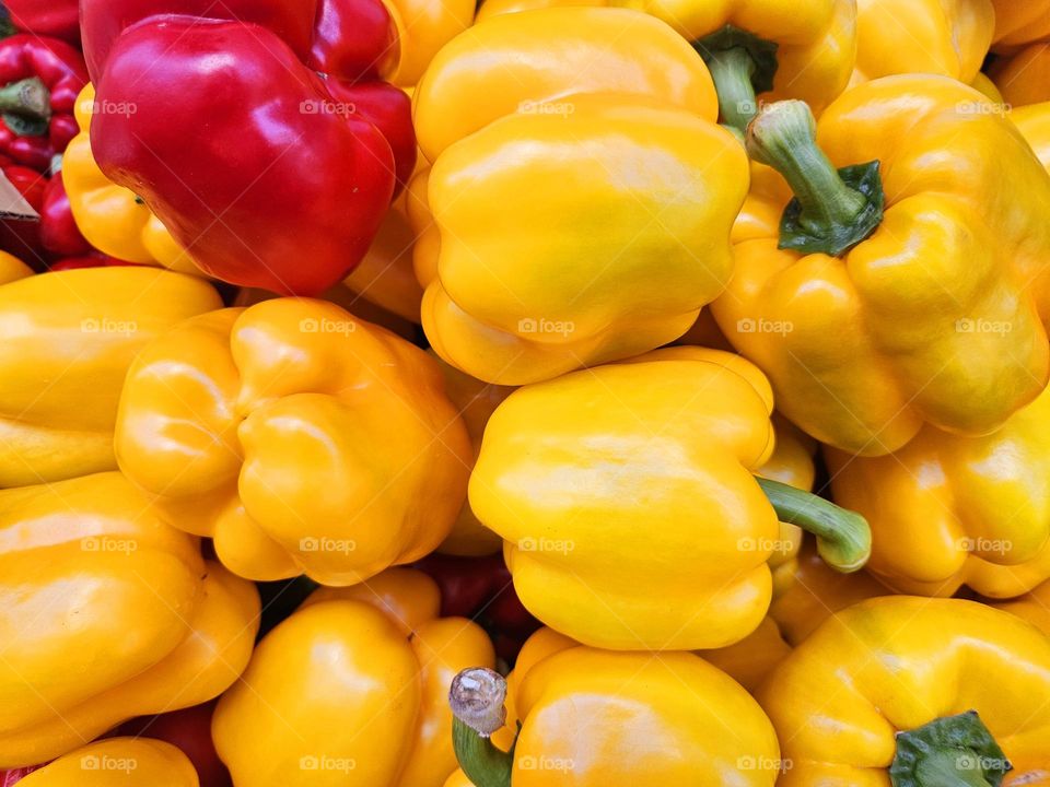 pile of red and yellow peppers