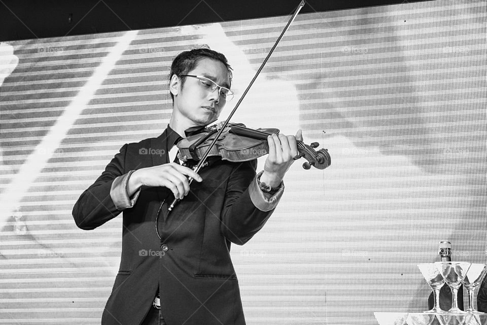 Young violinist playing violin