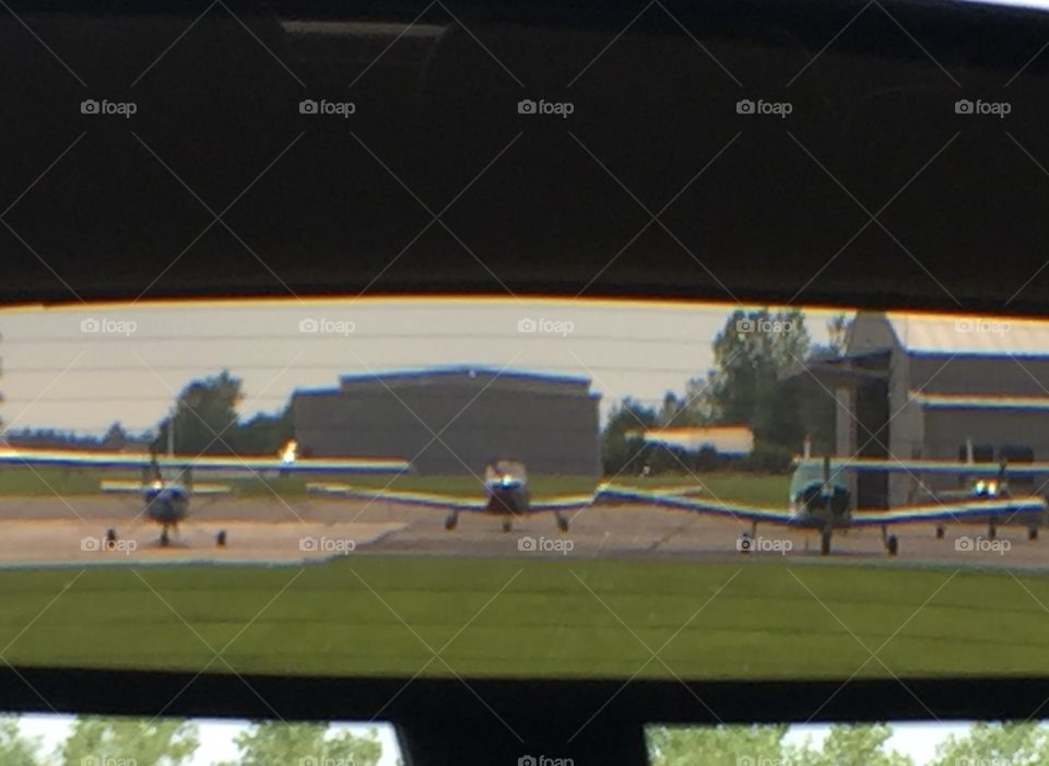 Small planes on the RAMP, pictured through my rear view mirror. 
Ledgedale Airport
Sweden NY