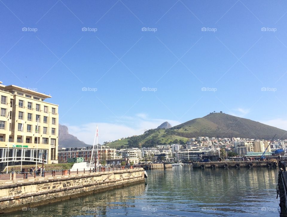 Landscape view overlooking V&A Waterfront and Signal Hill in the background with Lions Head further back 