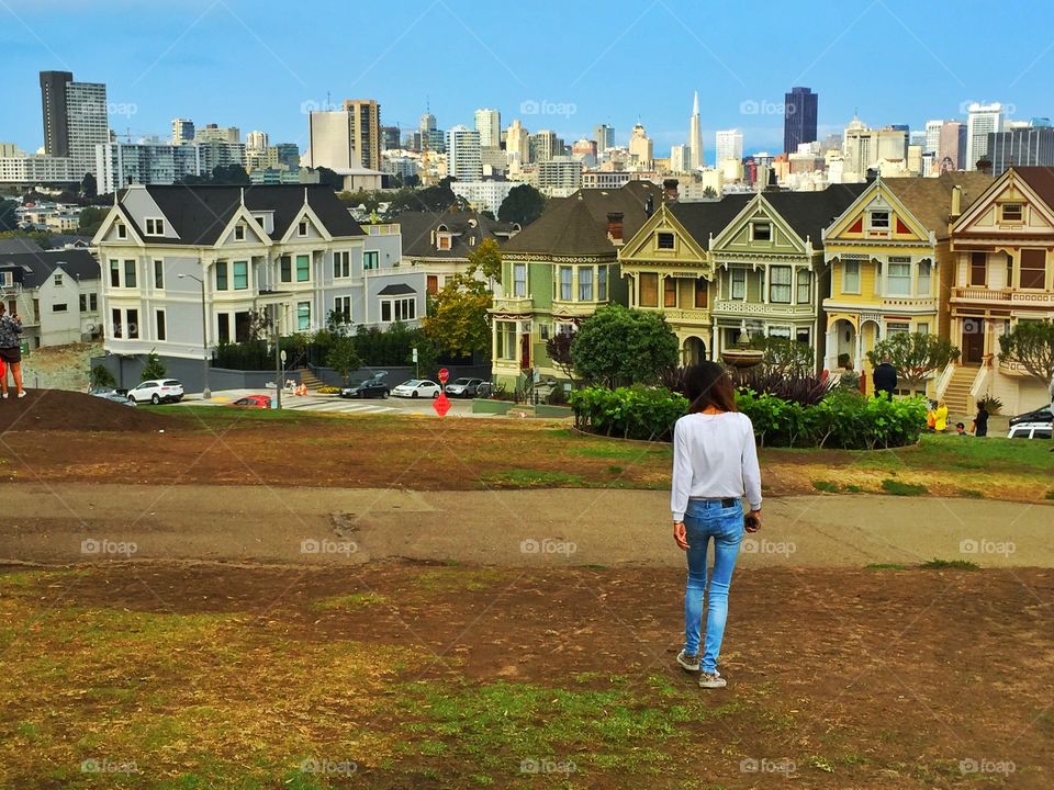 Tourist walk to alamo square