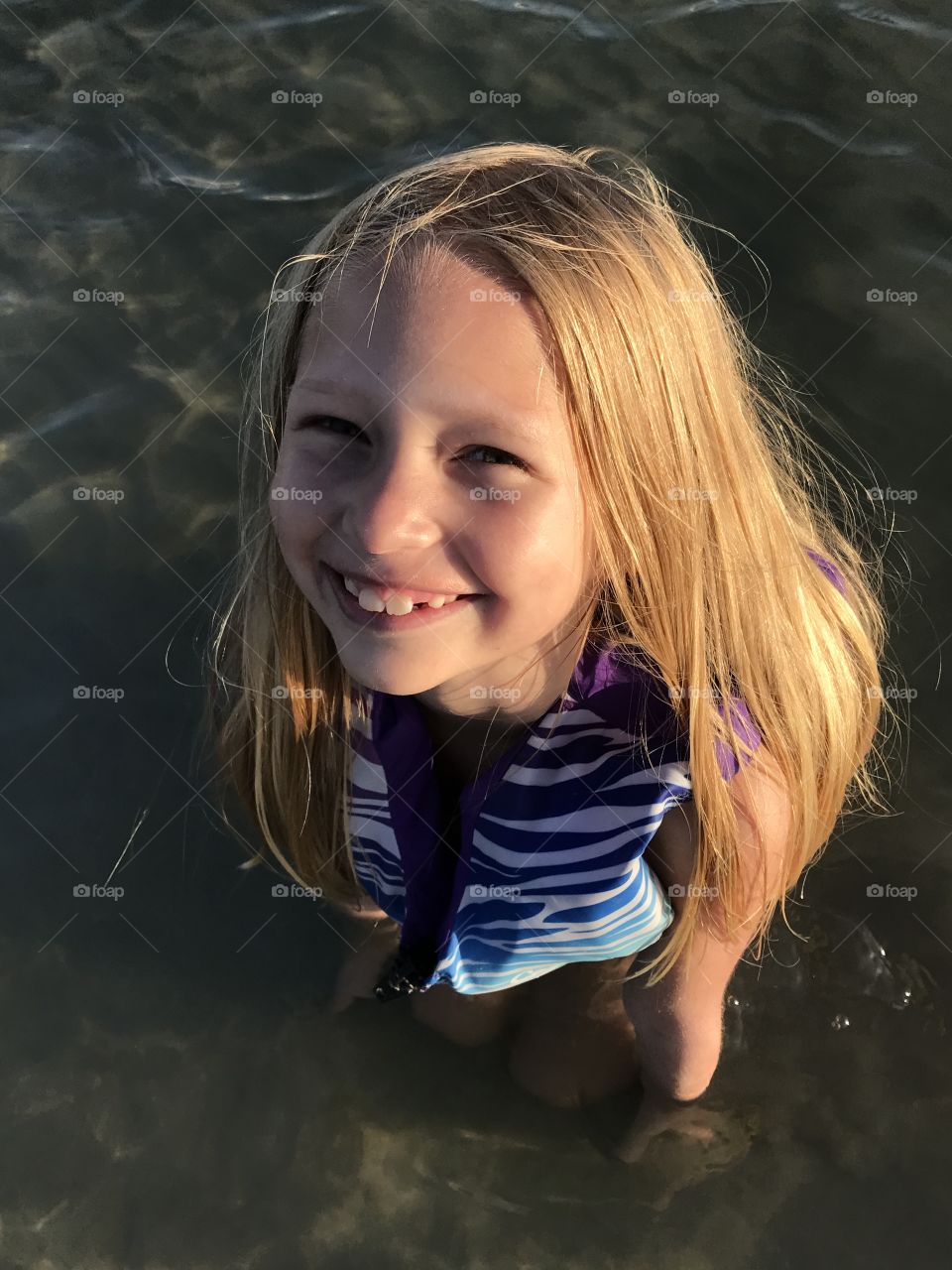 Little girl excited to be in the water