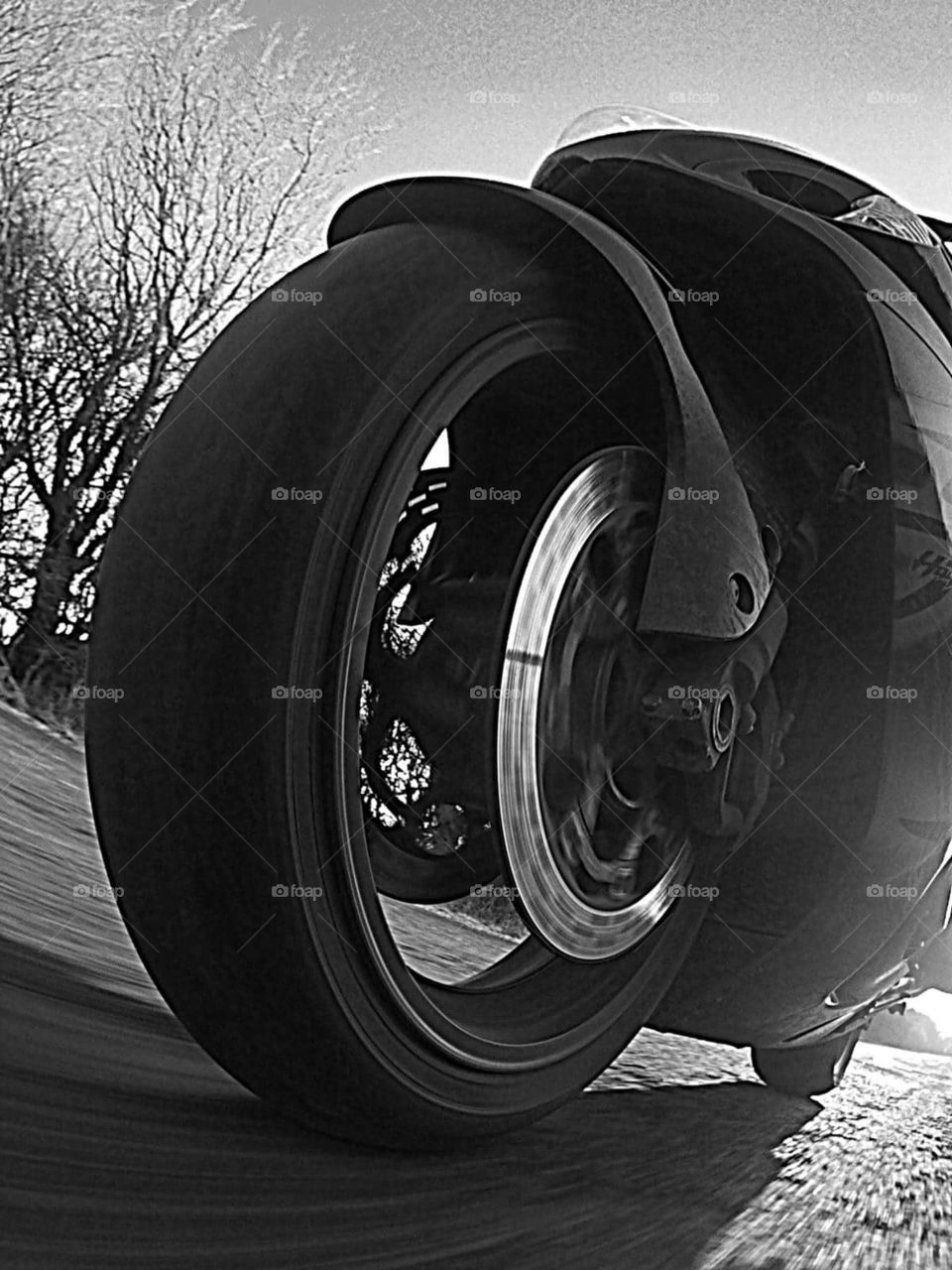 motorcycle wheel at speed road