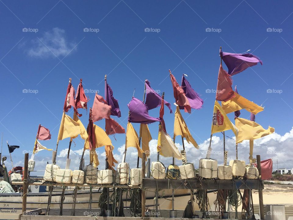 Line of fishermen flags in wind