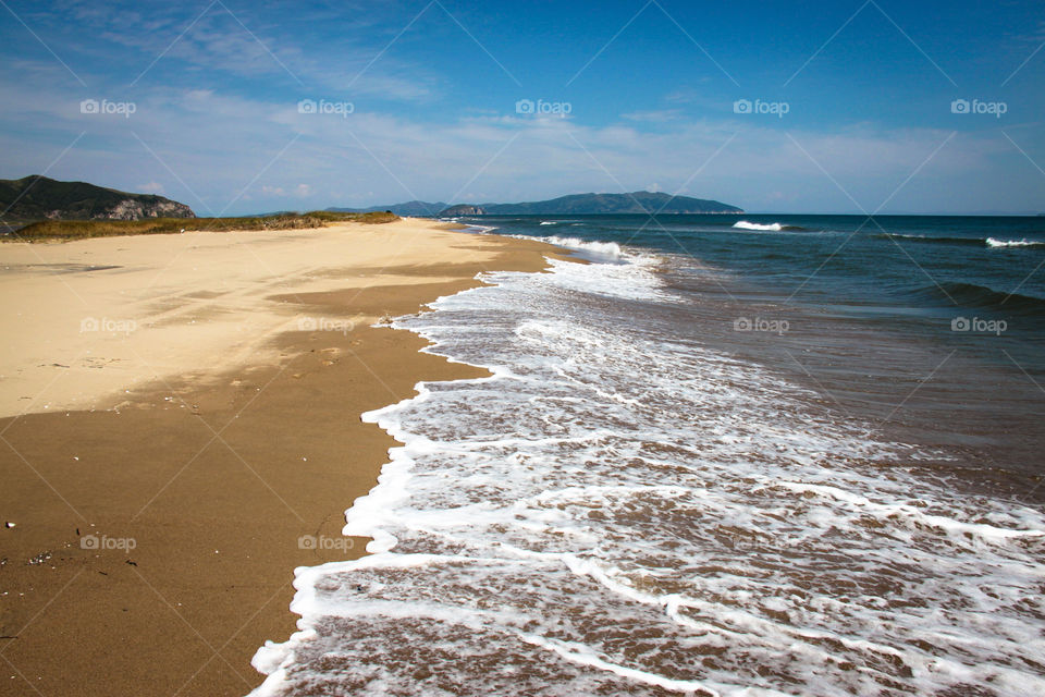 Waves on the sandy coast.