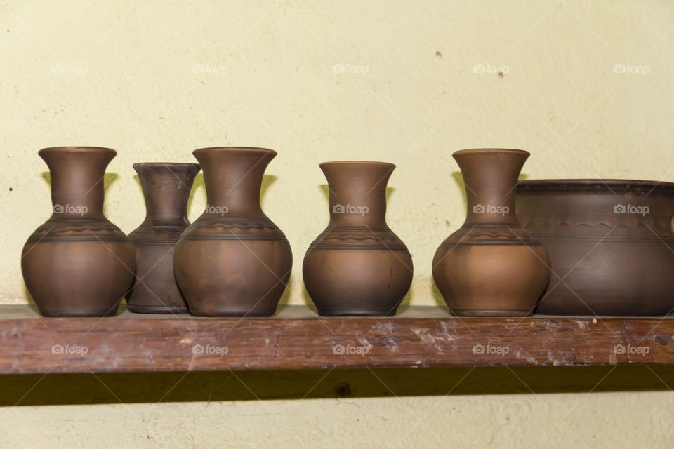 Clay pots in a potter's workshop.  Preservation of the culture and traditions of pottery.