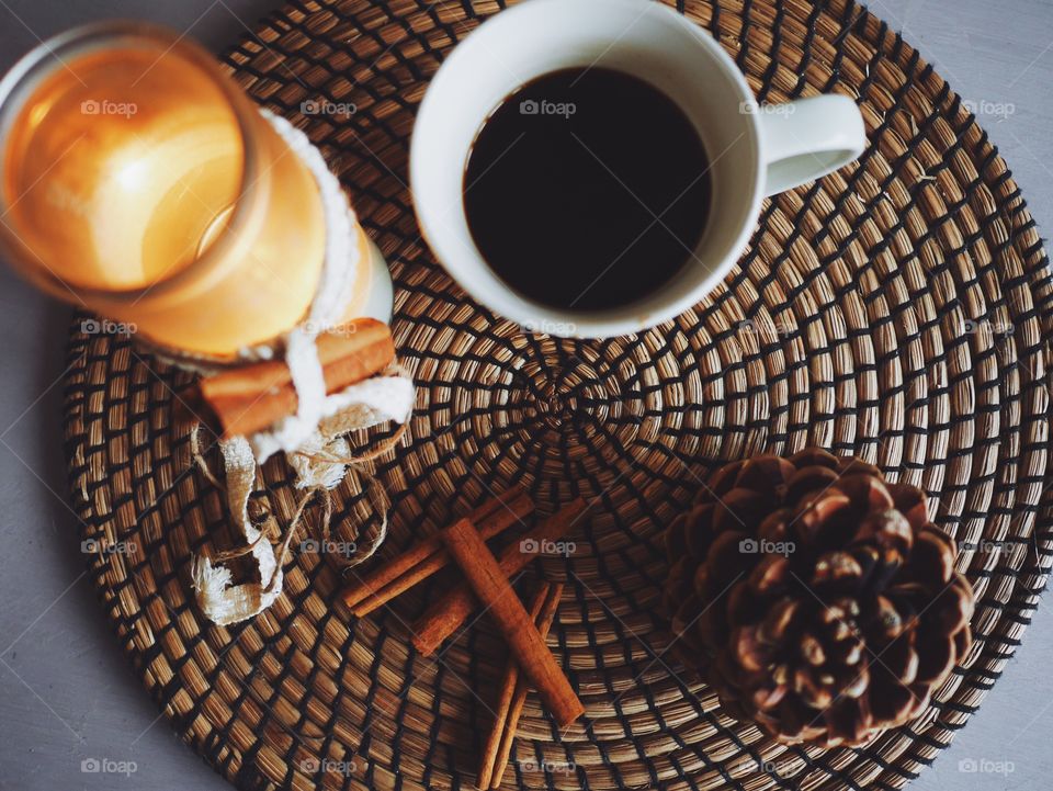 Close up of candle light and coffee cup