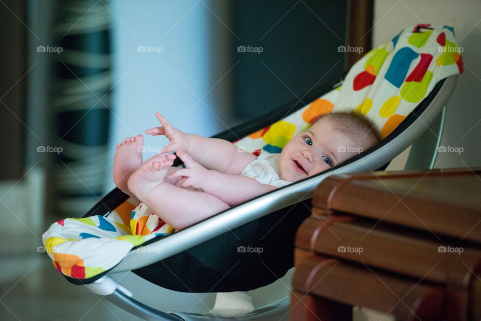 Smiling baby in her chair