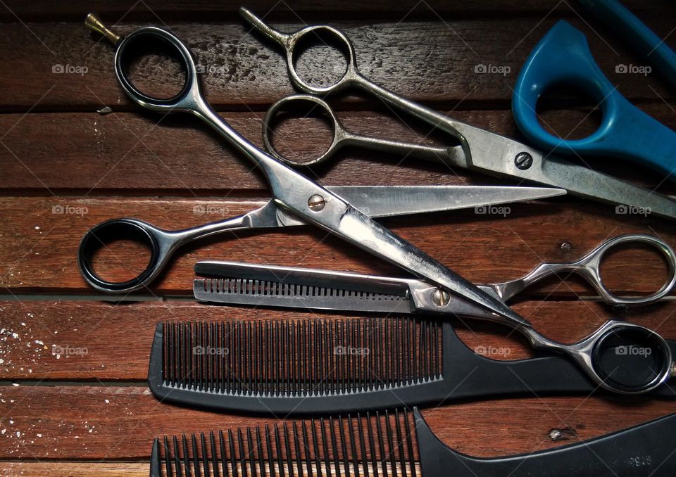 scissors and comb. wooden table