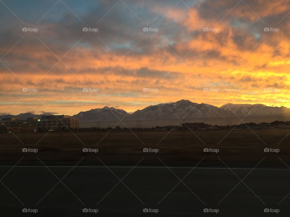 warm winter sunset over snowy Utah mountains