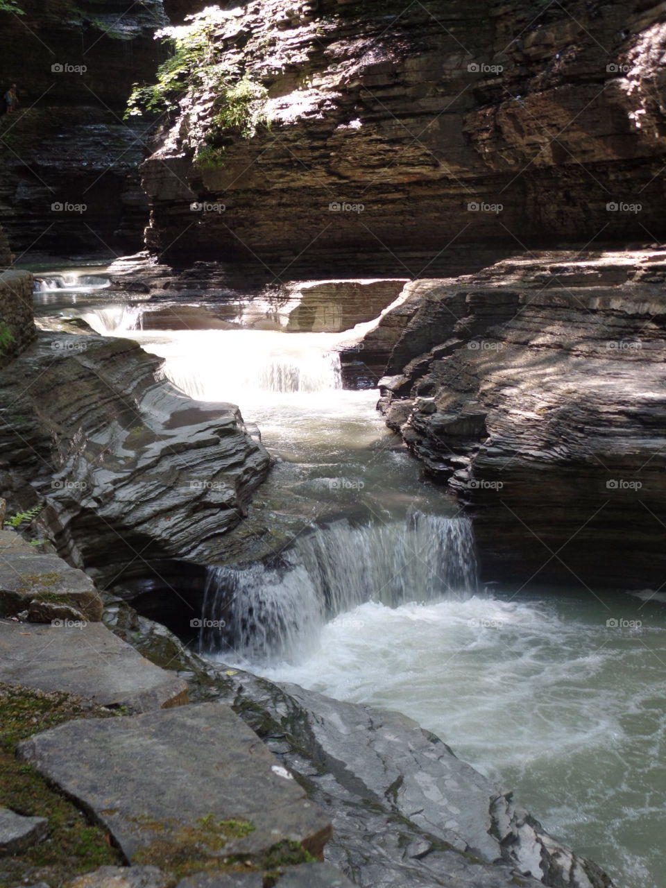 This natural waterfall tucked among these smooth rocks is the perfect place to simply relax to. 