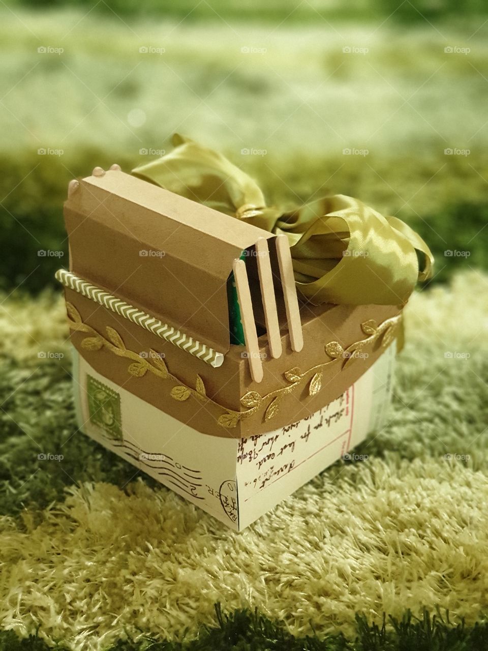 Explosion box card as a unique personalised gift with large green satin ribbon