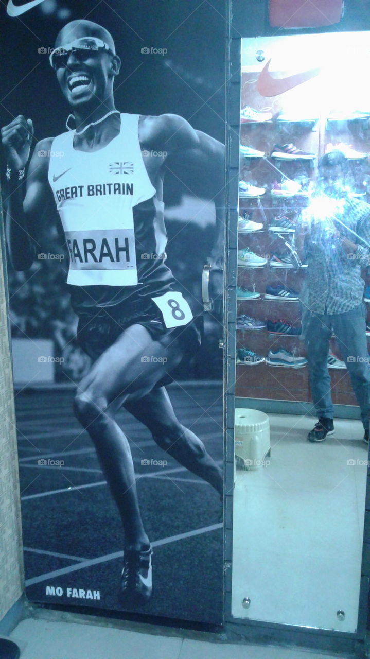 A brand poster of Nike with Mo Farah in it.