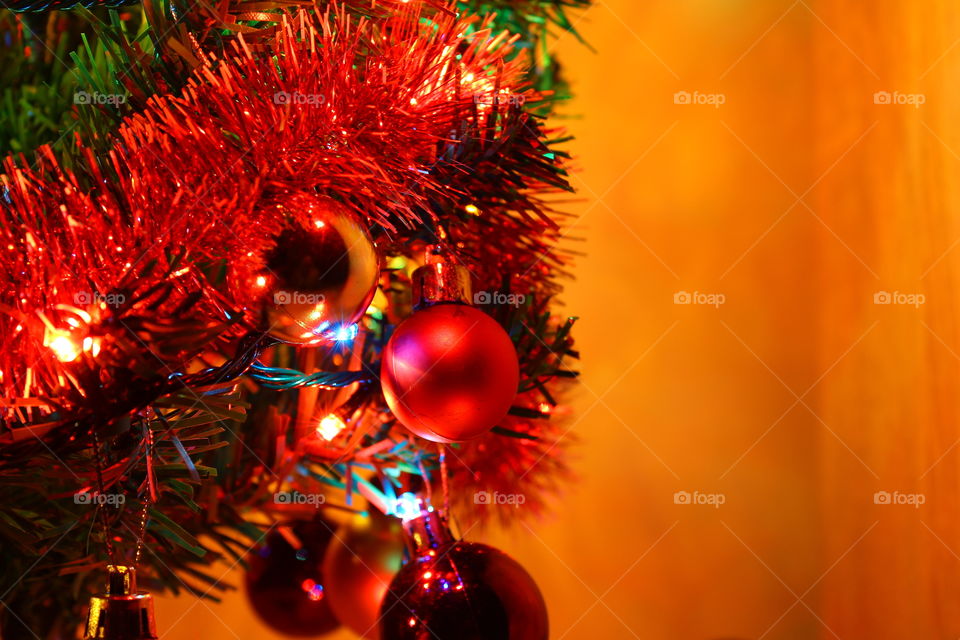 Macro shot of Christmas tree decorations and vivid lights