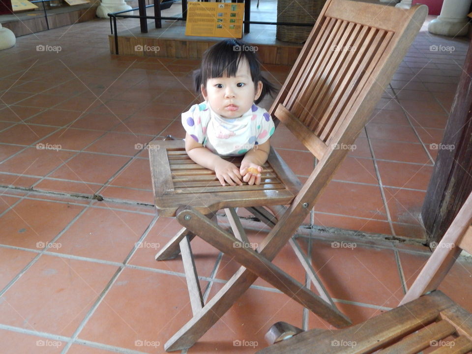 A little girl eating in hue, Vietnam 