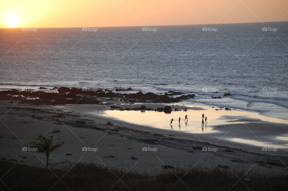 Playing football Jericoacoara beach 