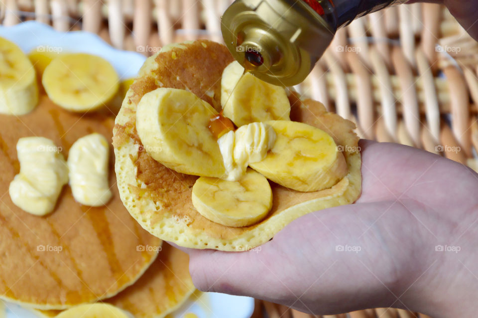 Close-up of a pancakes on hand