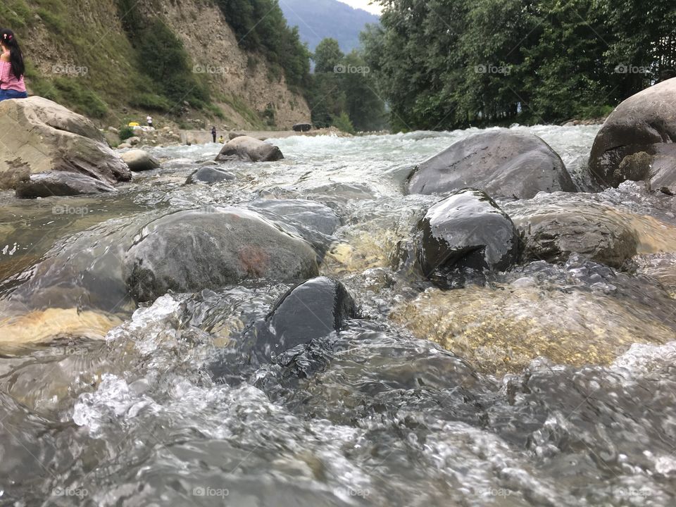 River water following in stones 