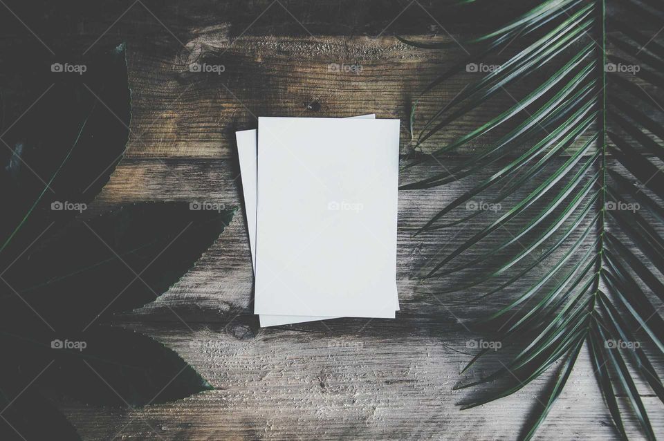 white paper sheet on Wooden table