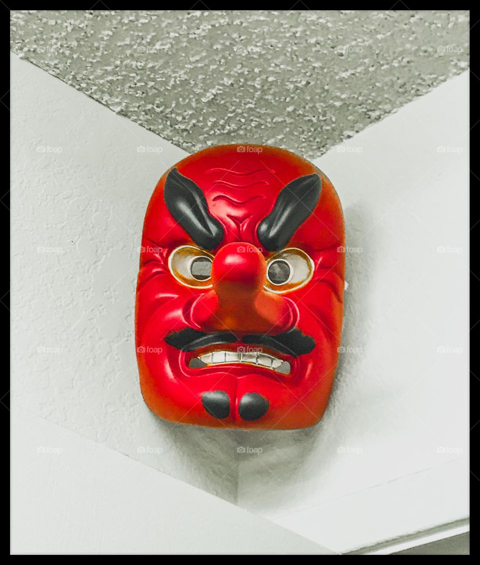 An enchanting Japanese curio mounted up at the corner inside the Bujinkan dojo office. It is known as a noh mask. This one depicts the face of a tengu, a crow-like demon from the ancient Japanese folklore.