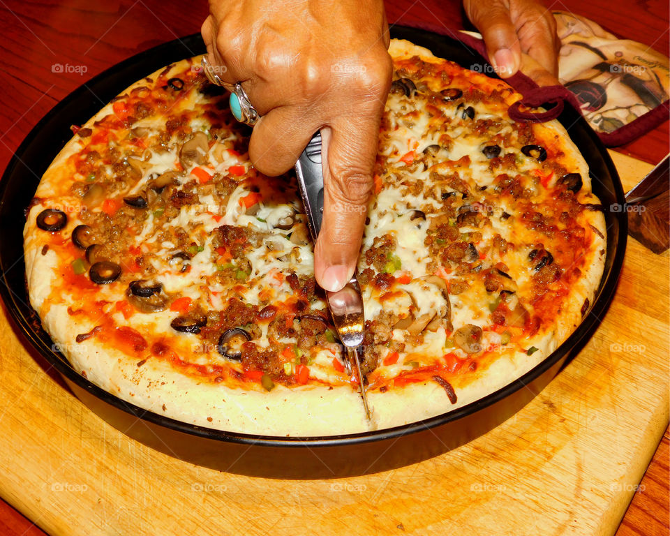 Delicious and nutritious homemade pizza with fresh, colorful vegetables, meats and a variety of spices! Grab a slice!