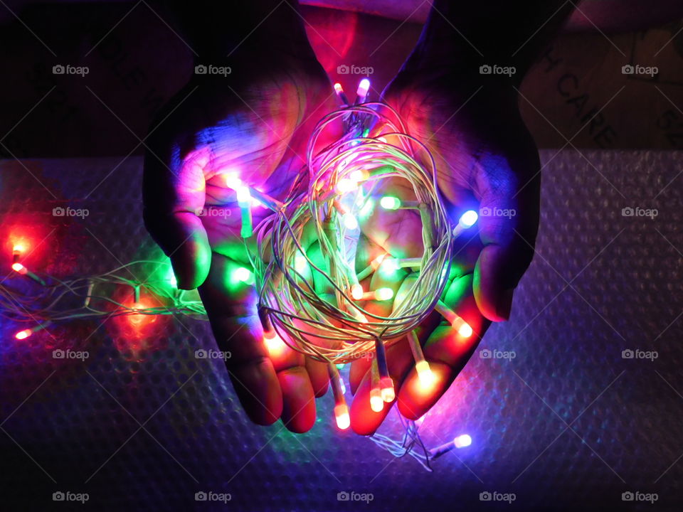 Creative Colourful lighting in hand