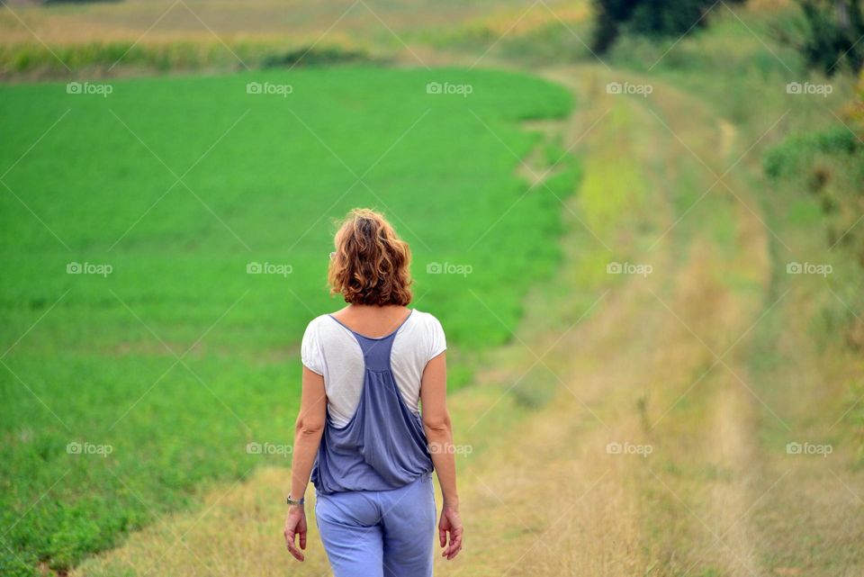 a girl looking countryside landscape