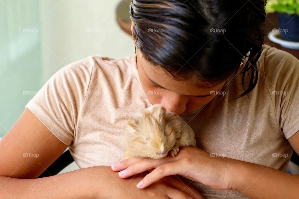 girl with her guinea pig