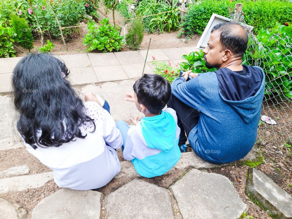 Father and Children sitting in the park