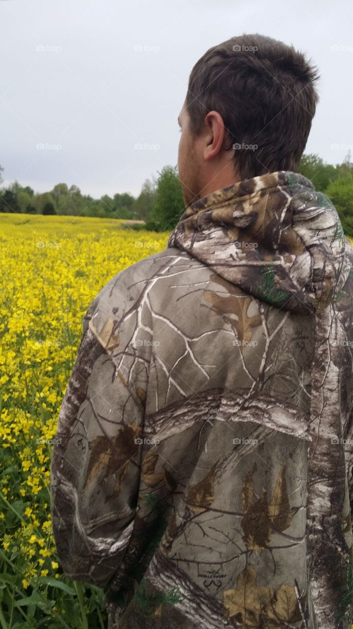 Beauty and the Beast. Hunter in a field of Goldenrod 