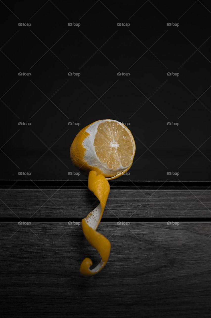Lemon on table against dark background