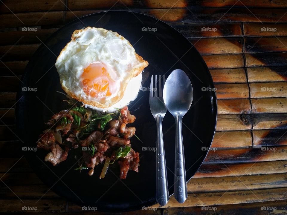 Fried rice with pork and fried egg. Thailand spicy food.