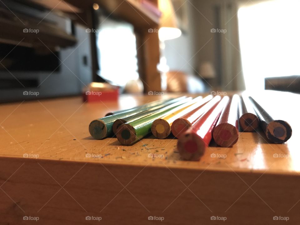 Pencil crayons lying on a desk