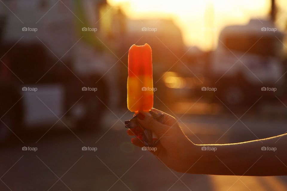 Girl holding a color  ice cream