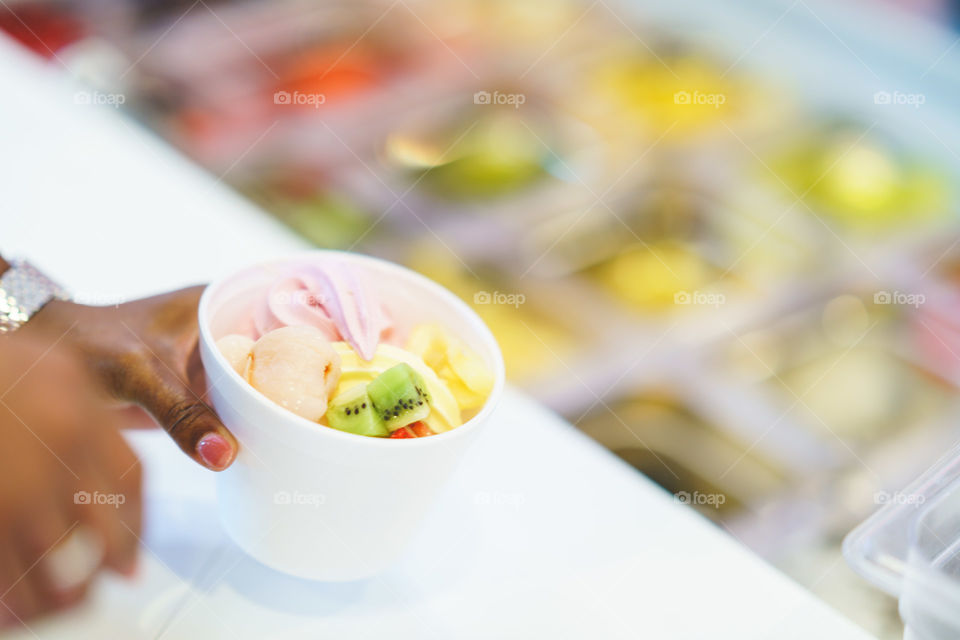 Ice cream with fresh fruits in cup