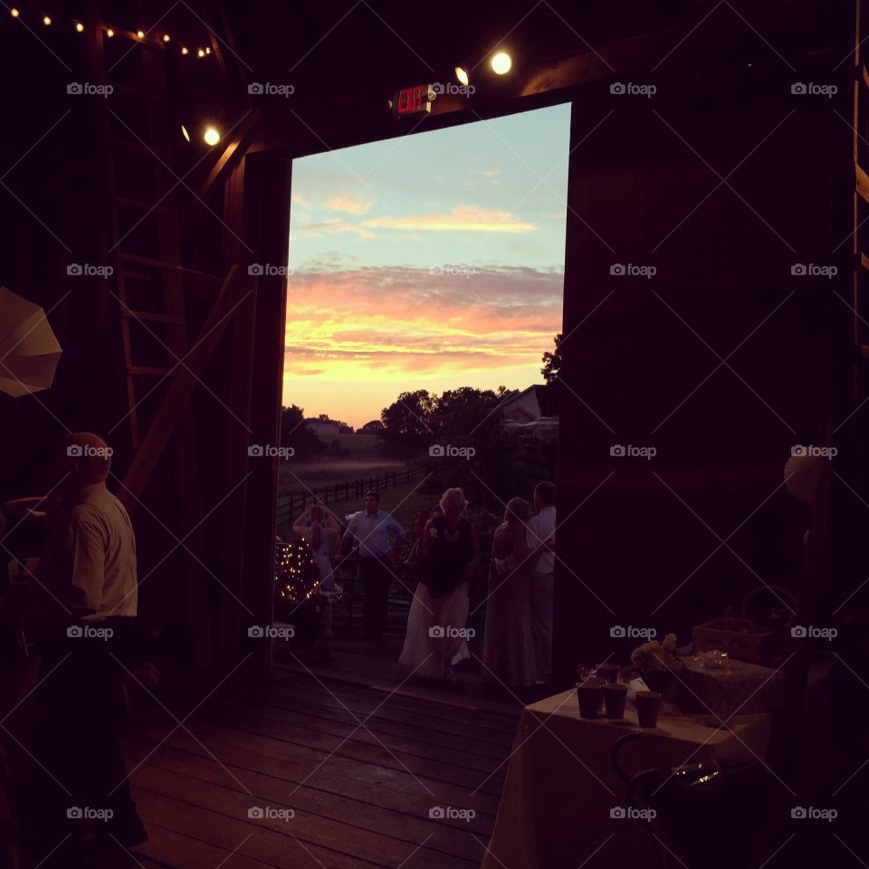 Sunset through barn door at wedding in Virginia