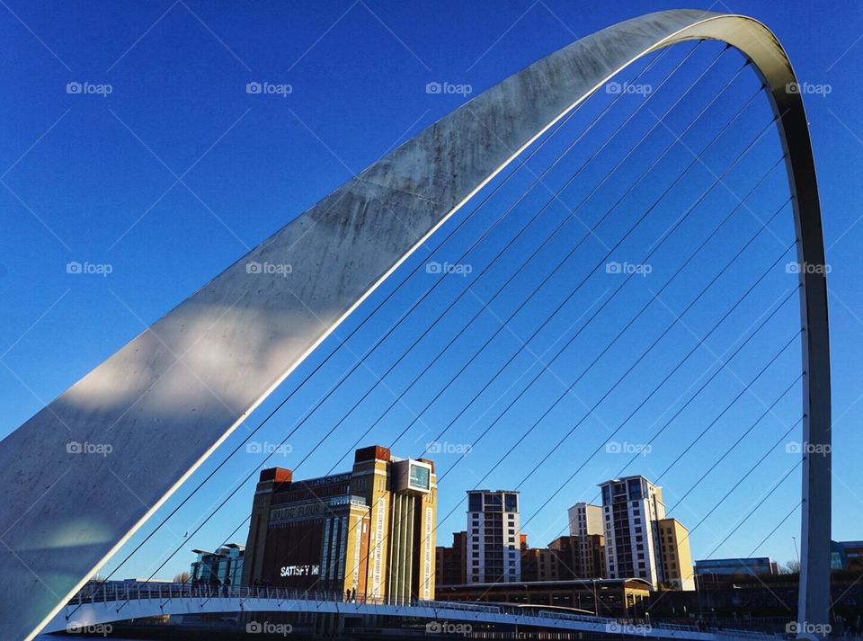 Walk over the Millennium Bridge Newcastle UK to reach The Baltic on the other side of the river 