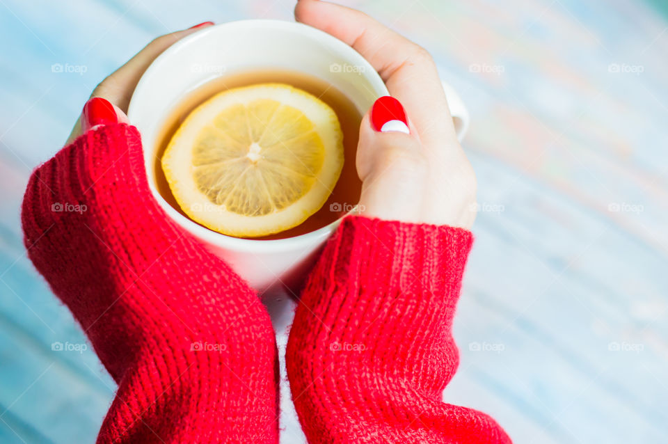 woman hand with cup of tea