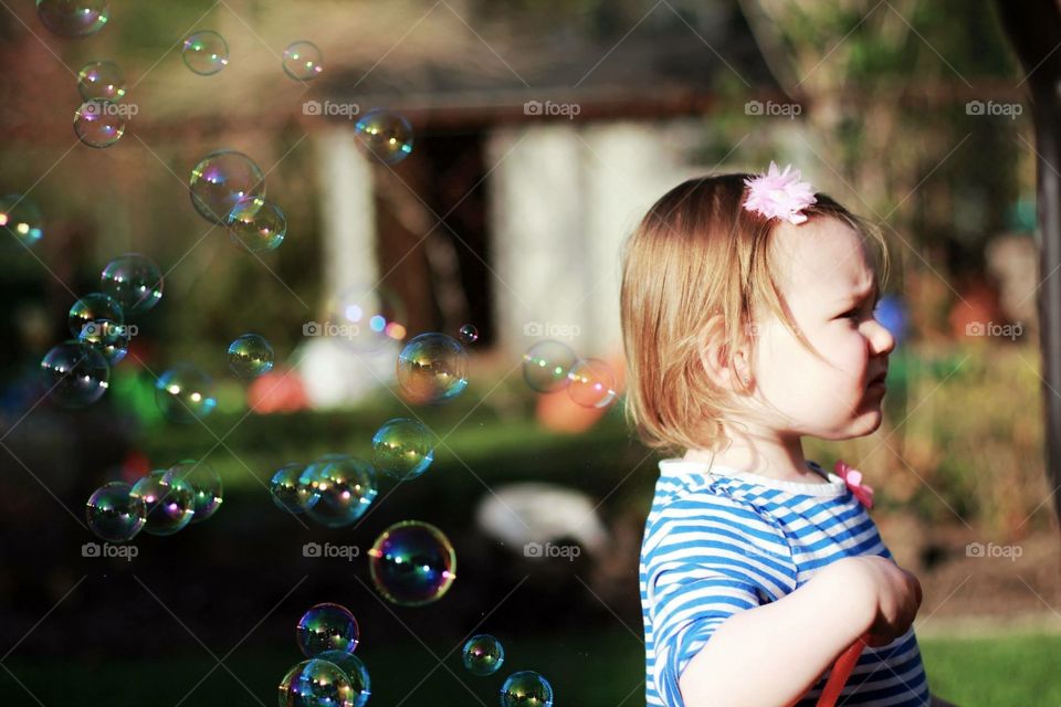 Toddler Playing with Bubbles 