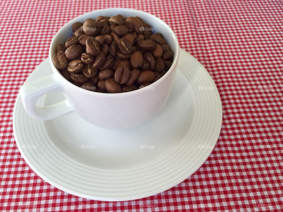 Coffee. Cup filled with coffee beans