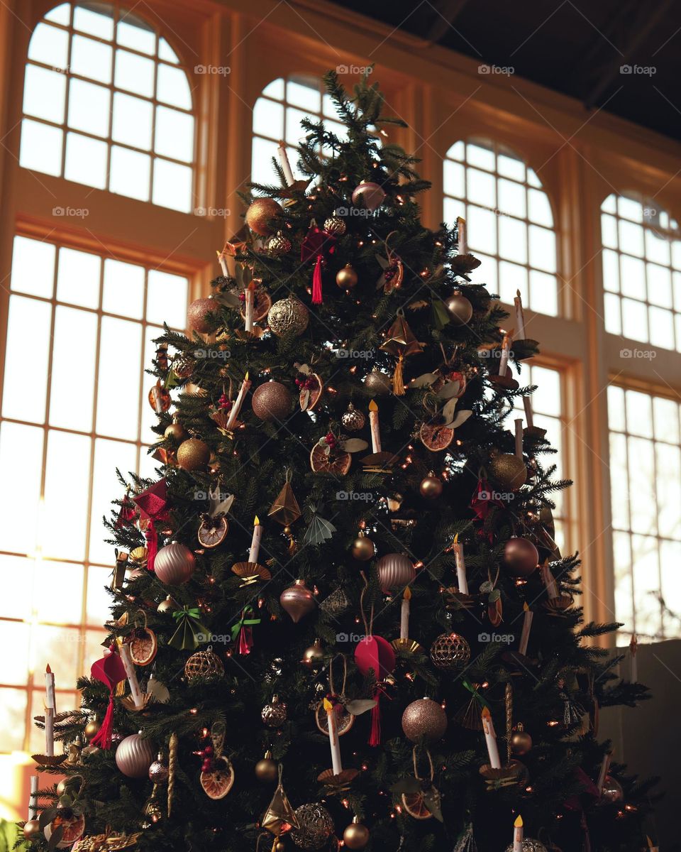 Christmas tree with beautiful decoration on it in hall 