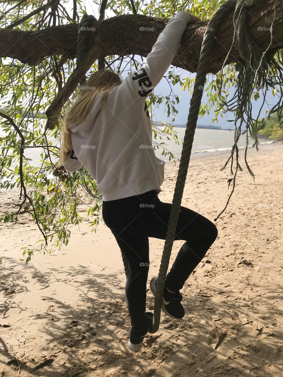 Child on a rope swing 