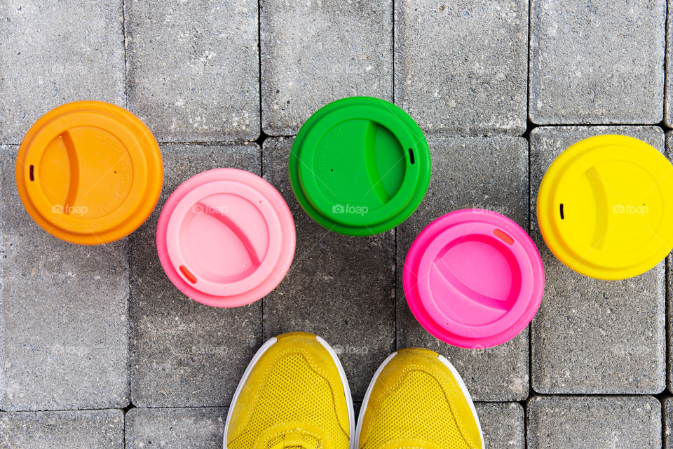 Bamboo reusable coffee or tea cups mugs with multicolor silicone cap. Zero waste. Sustainablelifestyle. Flat lay. Top view