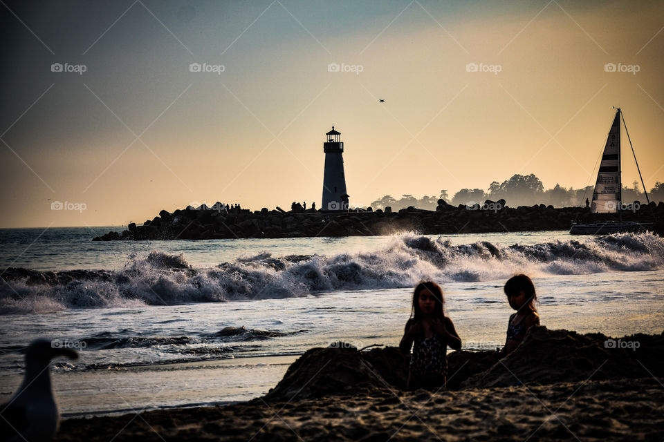 playing in the sand with her best friend...