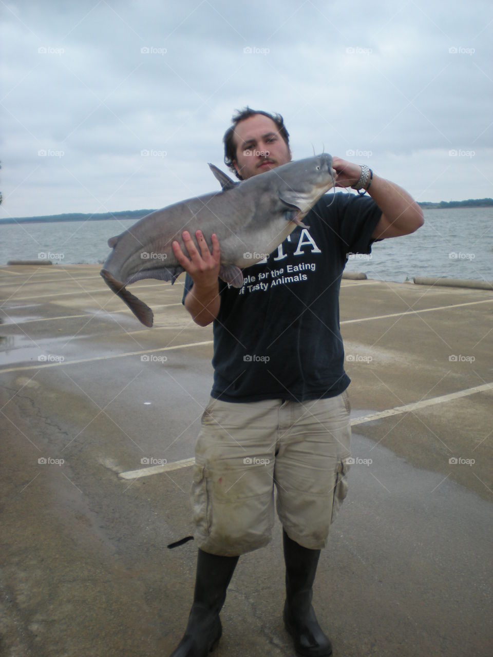 Man holding a large catfish. Man holding a large catfish
