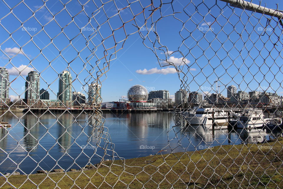 Science works, skyline, chain link fence, water, grass, nature, architecture, summer, Canada, Vancouver, British Columbia 
