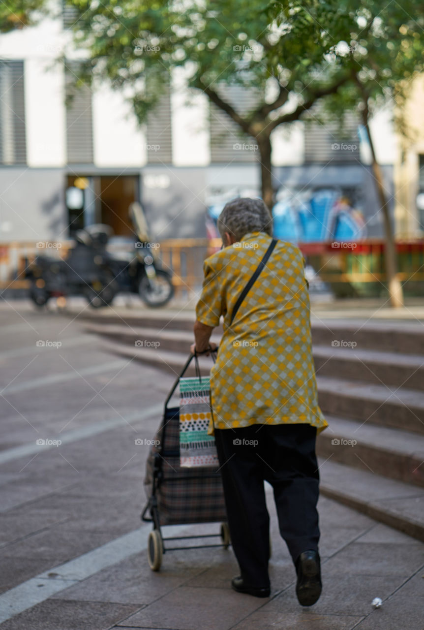 Elderly woman going shopping