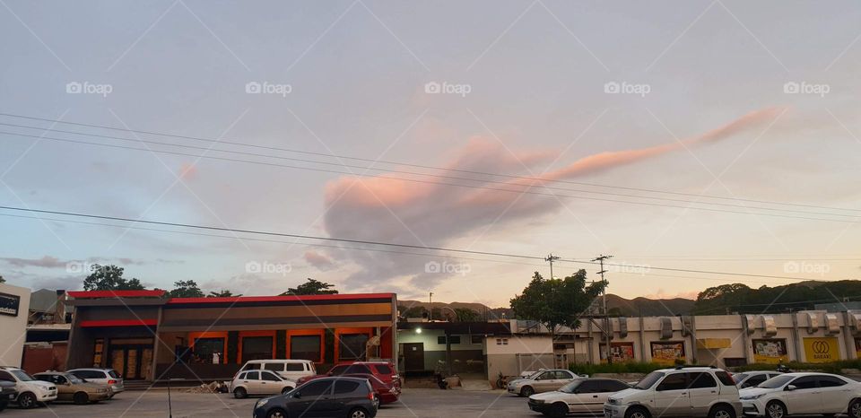 beautiful cloud that resembles a guitar in the sky